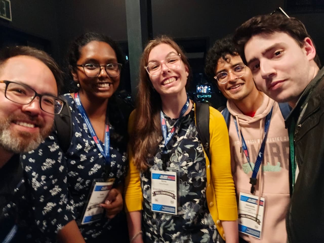 A rooftop selfie of Anna and four new friends at the top of the Hyatt after the conference reception.