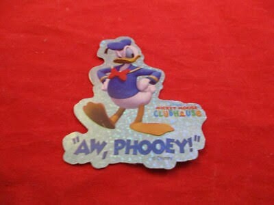 A glittery Mickey Mouse Clubhouse sticker of Donald Duck, hands on hips, over the words “Aw, phooey!”